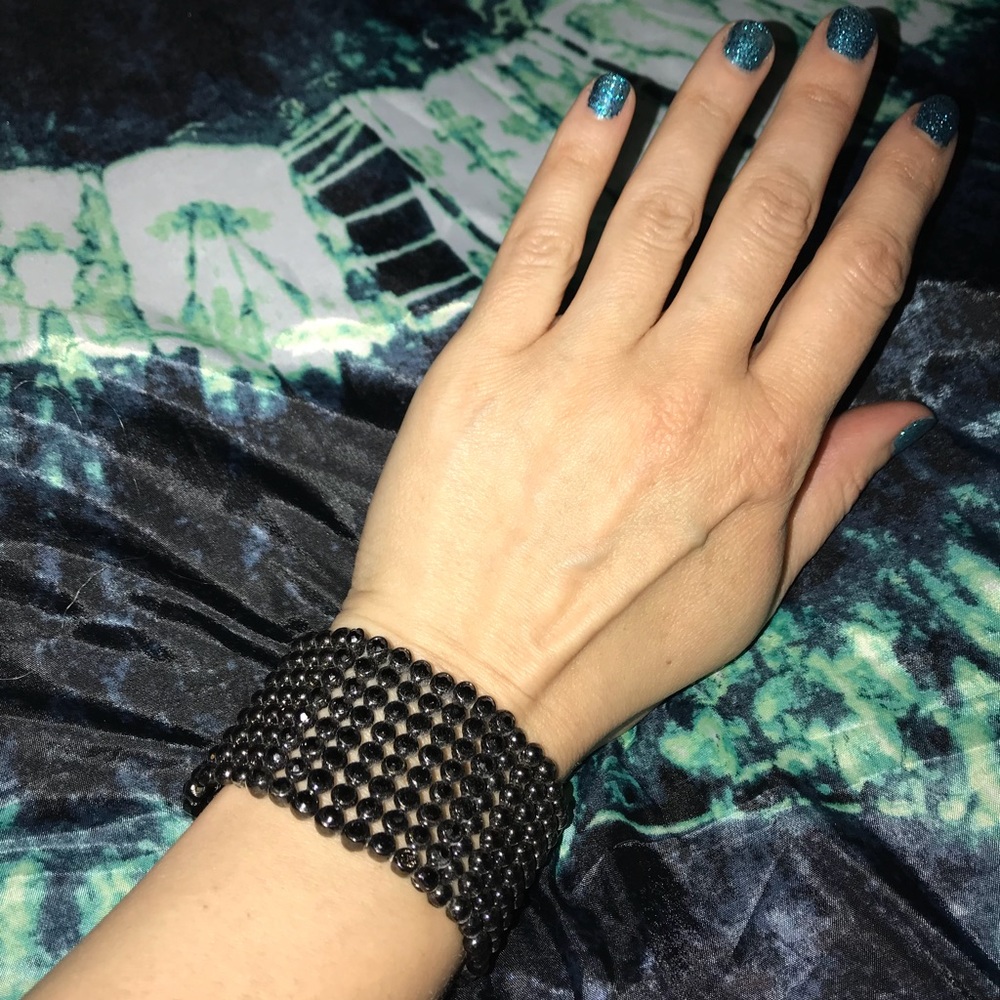 Black beaded bracelet. Heavy and sparkles up close